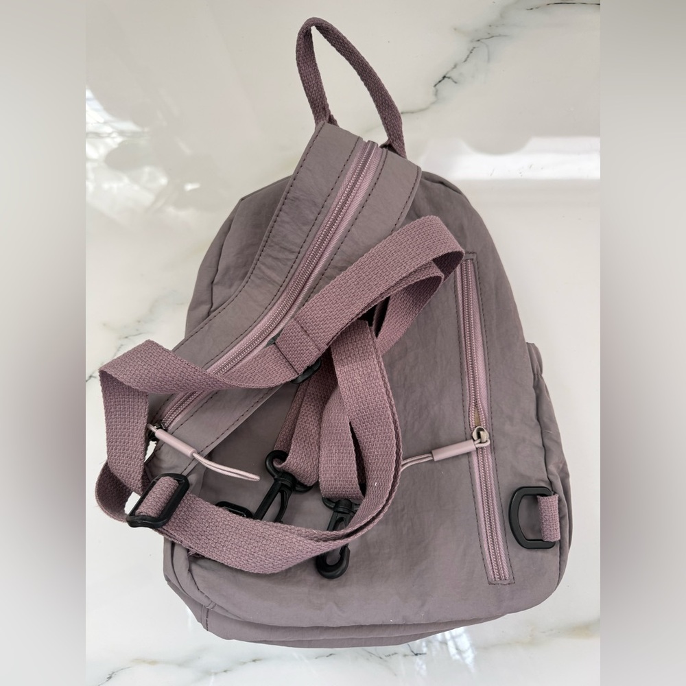 Gray Backpack With Multiple Pockets - image 2